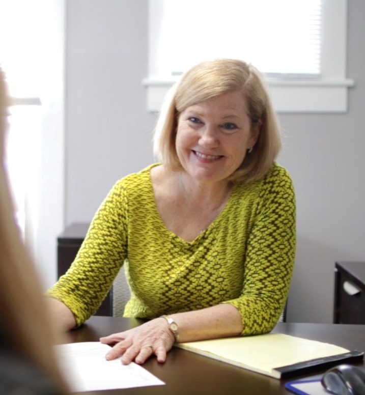 mortgage consultant at desk with client